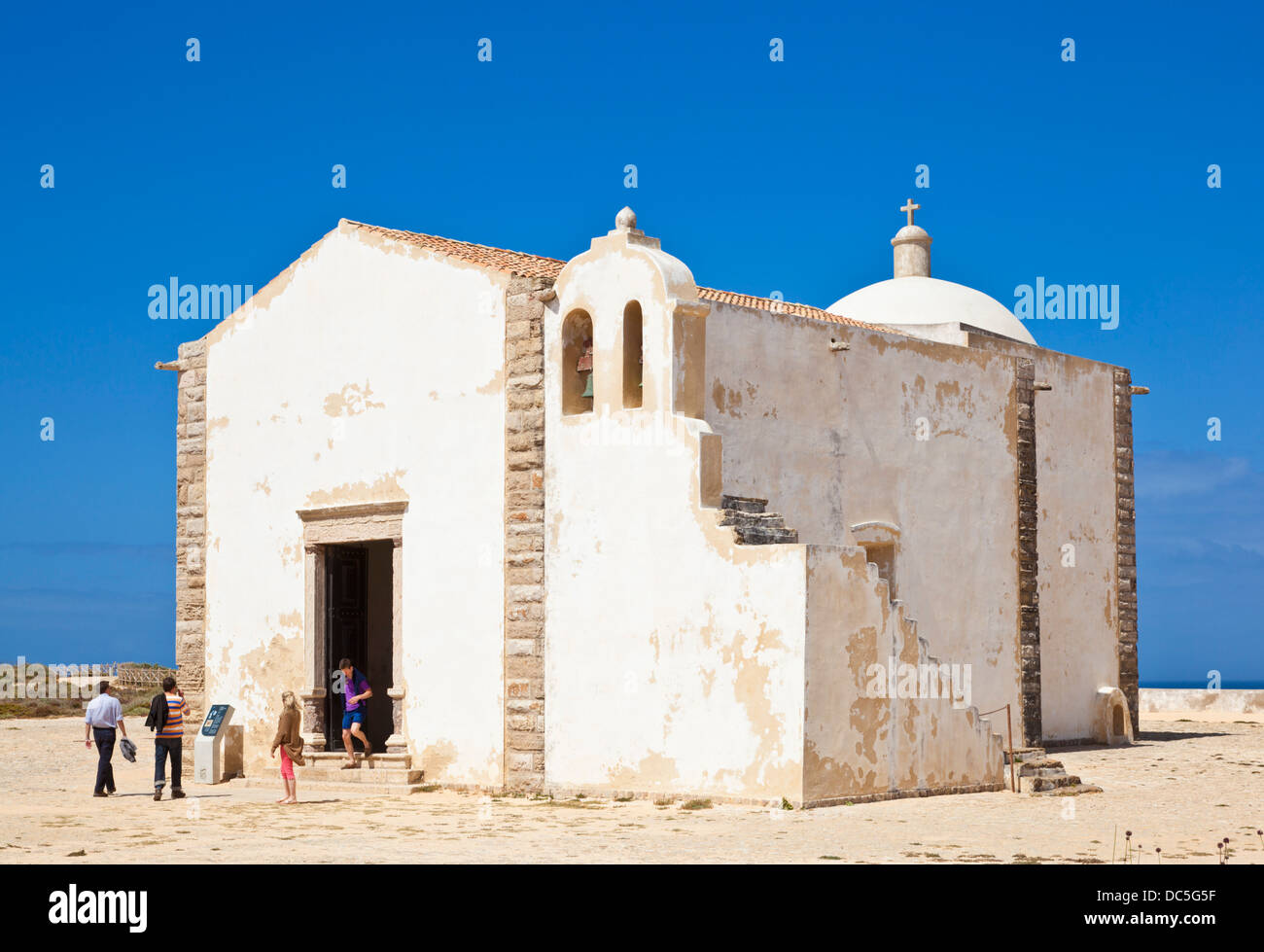 People visiting the Capela De Santa Maria Da Graca church  chapel Fortaleza de Sagres fort Algarve Portugal EU Europe Stock Photo