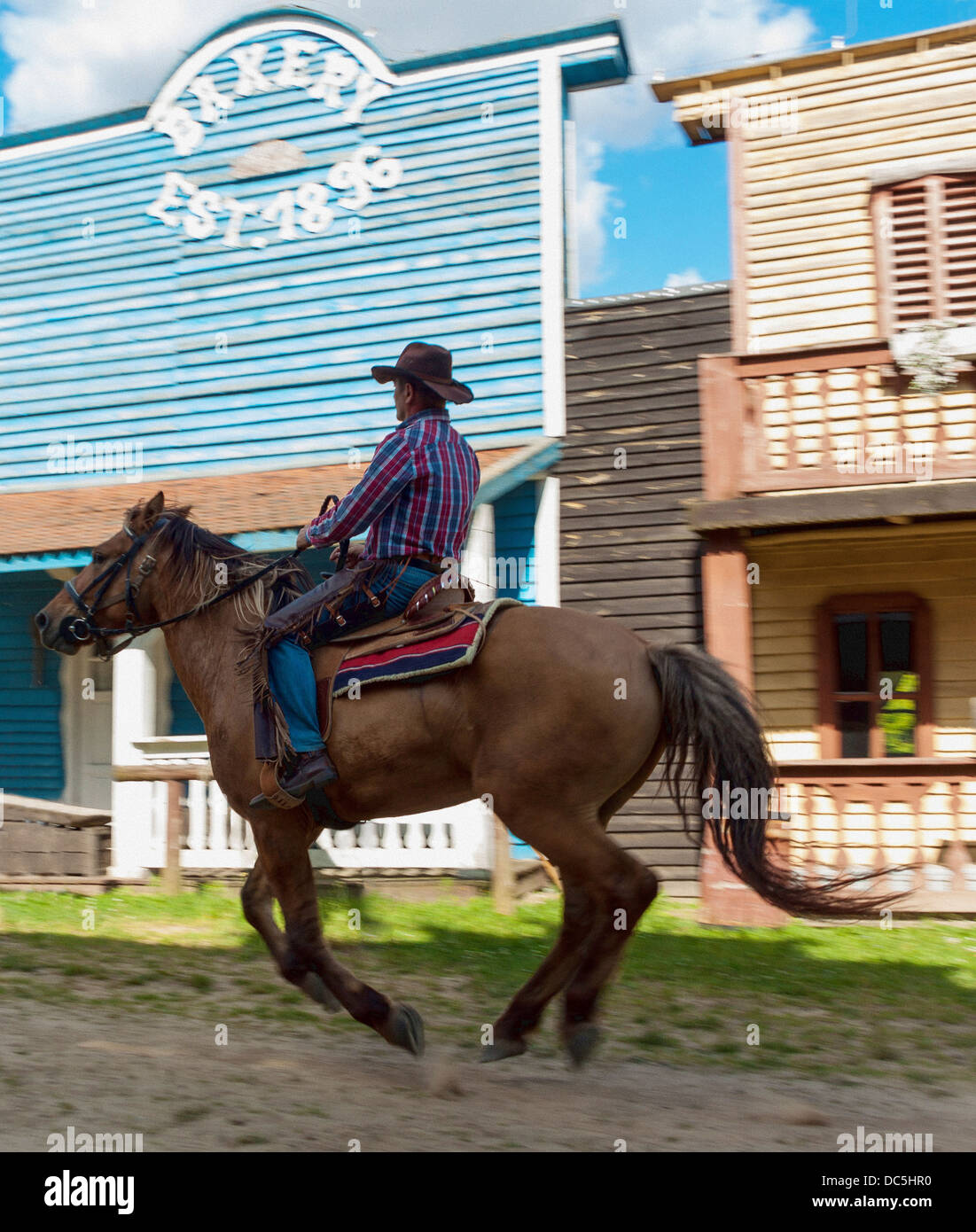 Cowboy Ride Cowboy riding horse in the western city hi-res stock photography and ...