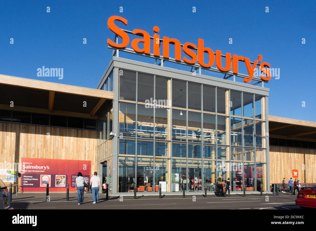 A large sign over the entrance to the Sainsbury's supermarket at Hardwick Road, King's Lynn. Stock Photo