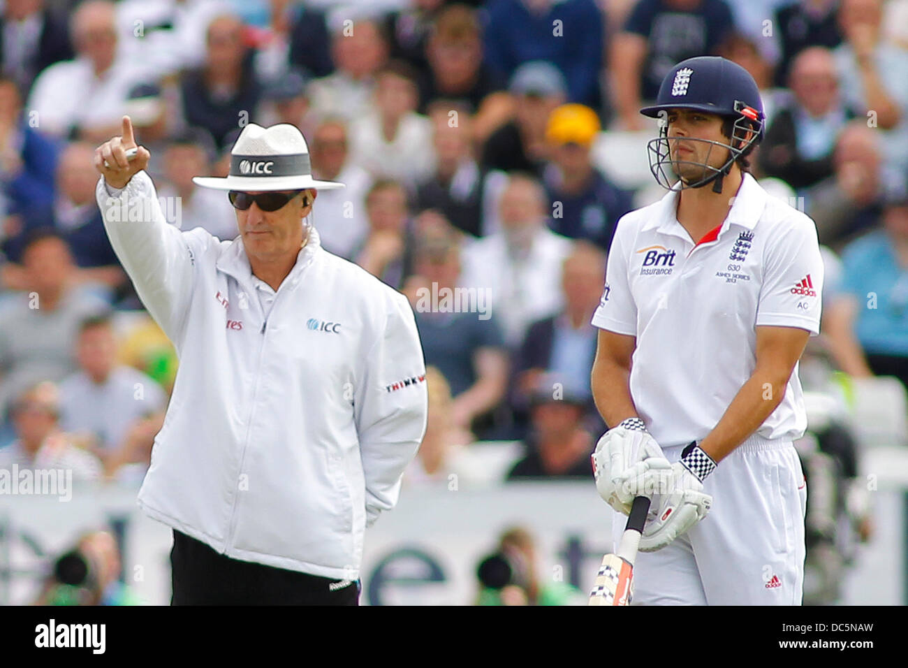 Chester Le Street, UK. 09th Aug, 2013. Umpire Tony Hill signals out for Jonathan Trott as Alastair Cook looks on during day one of the Investec Ashes 4th test match at The Emirates Riverside Stadium, on August 09, 2013 in London, England. Credit:  Mitchell Gunn/ESPA/Alamy Live News Stock Photo