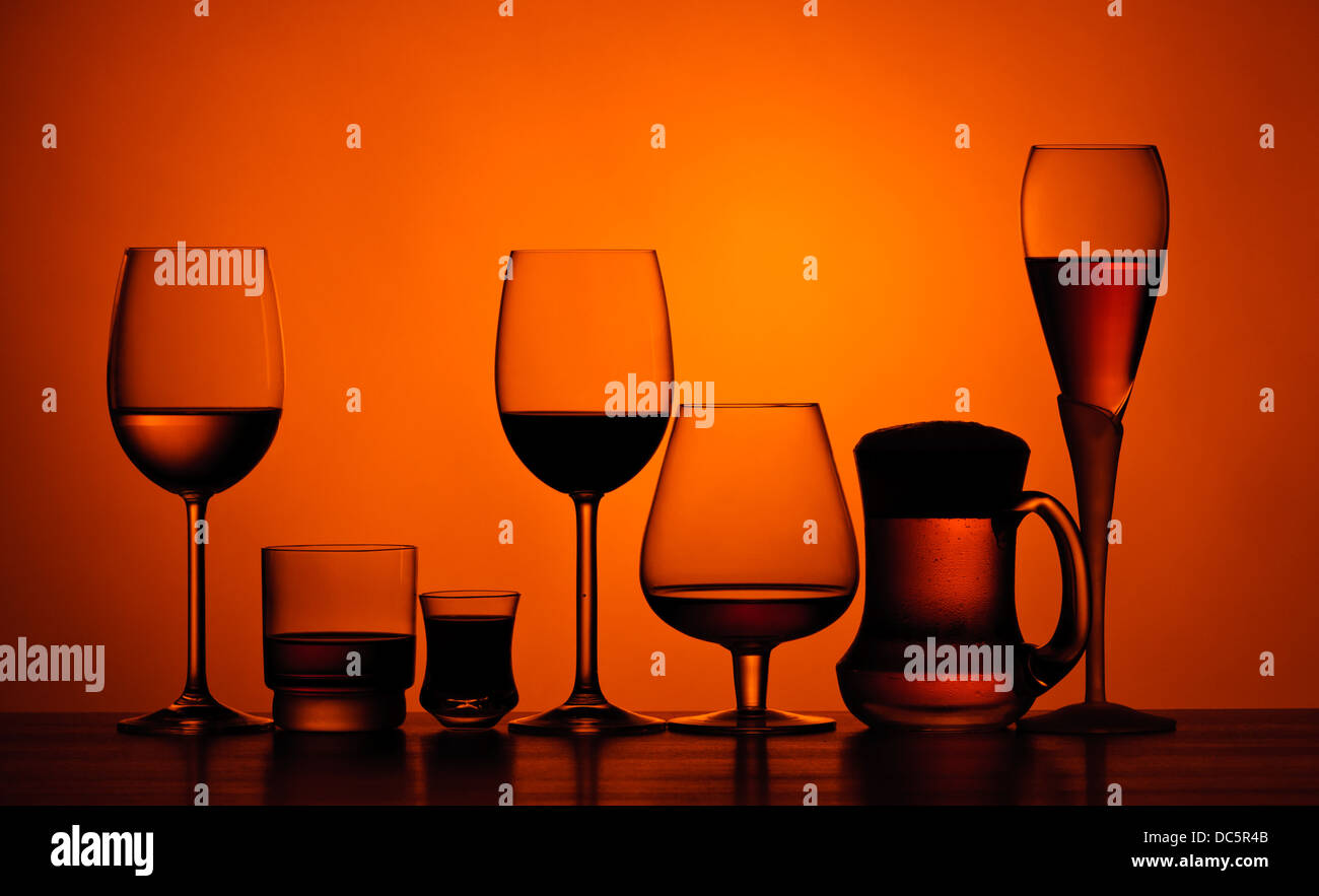 different glasses of alcoholic drinks on a table Stock Photo