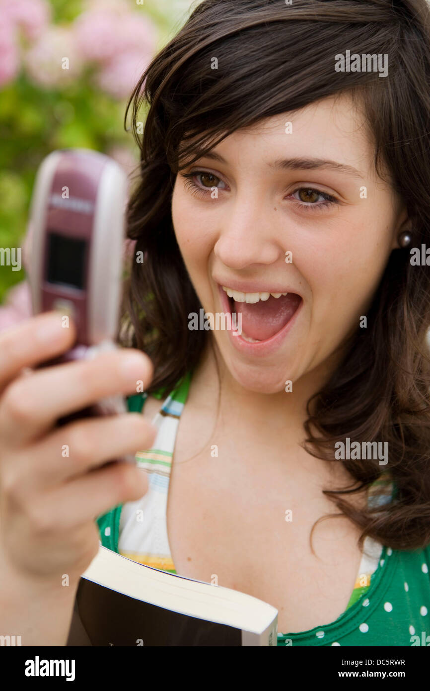 Seventeen year old girl reading a message Stock Photo Alamy