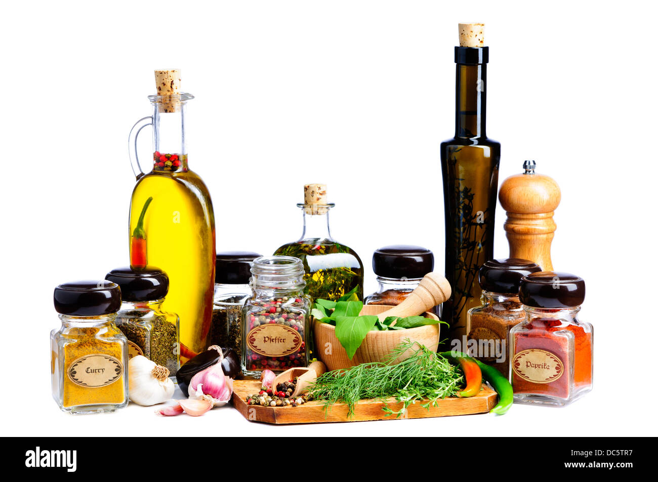 herbs, spices and infused olive oil for mediterranean cooking isolated on a white background Stock Photo