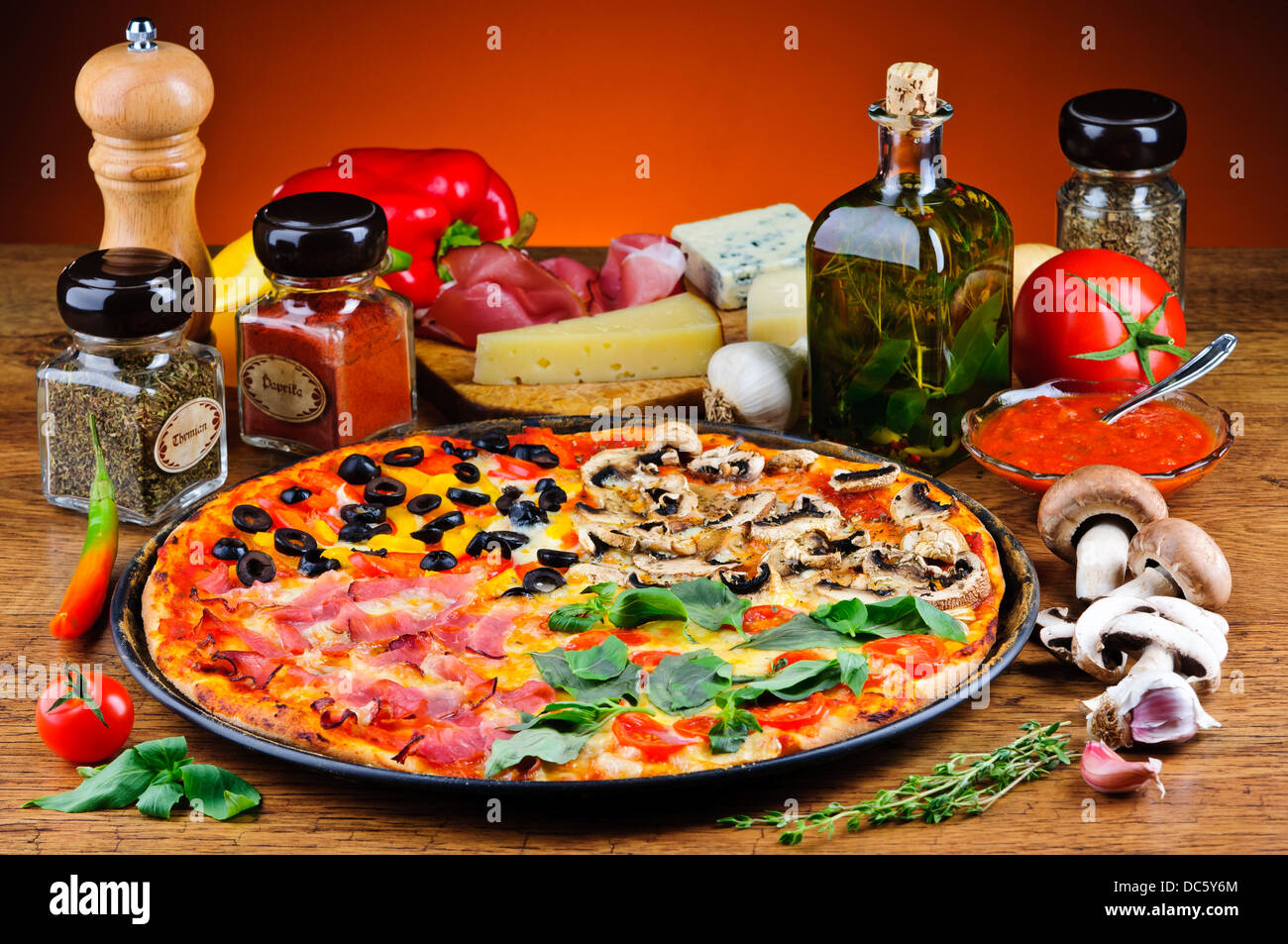 still life with traditional quattro stagioni pizza and ingredients Stock Photo