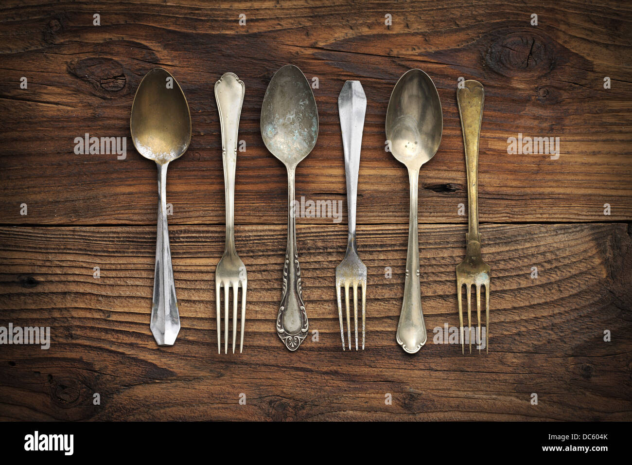 Old fashioned forks on wooden table hires stock photography and images