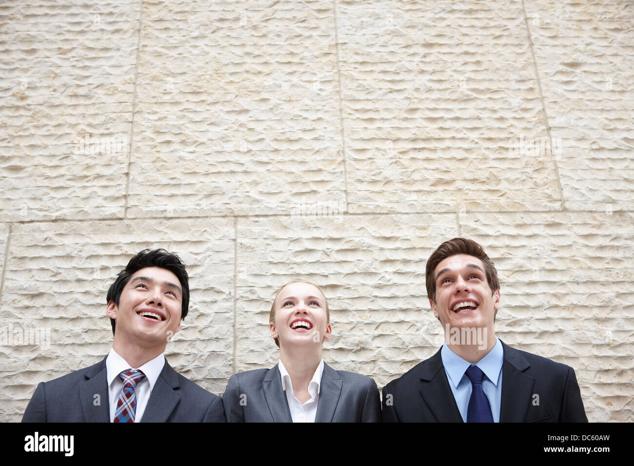 three business people aligned together Stock Photo Alamy