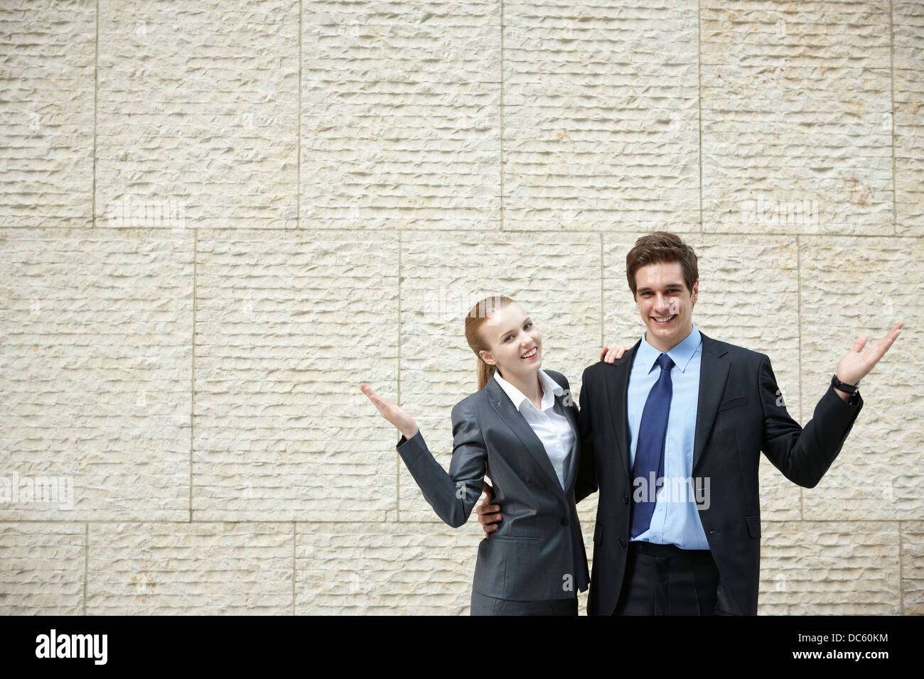 businessman and a businesswoman with I don't know pose Stock Photo