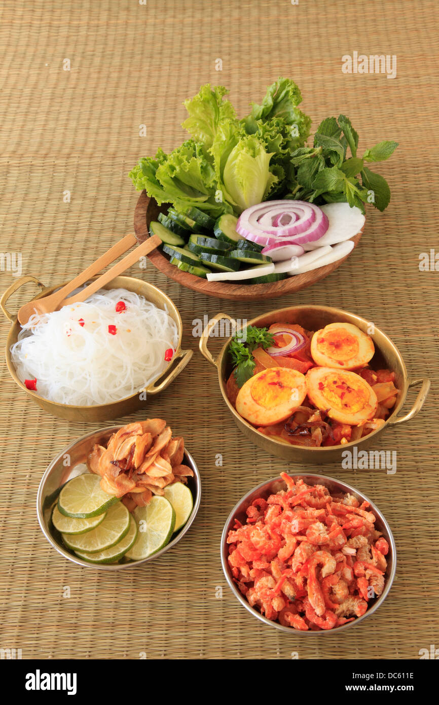 Burmese egg curry, rice noodles, salad, side dishes Stock Photo ...