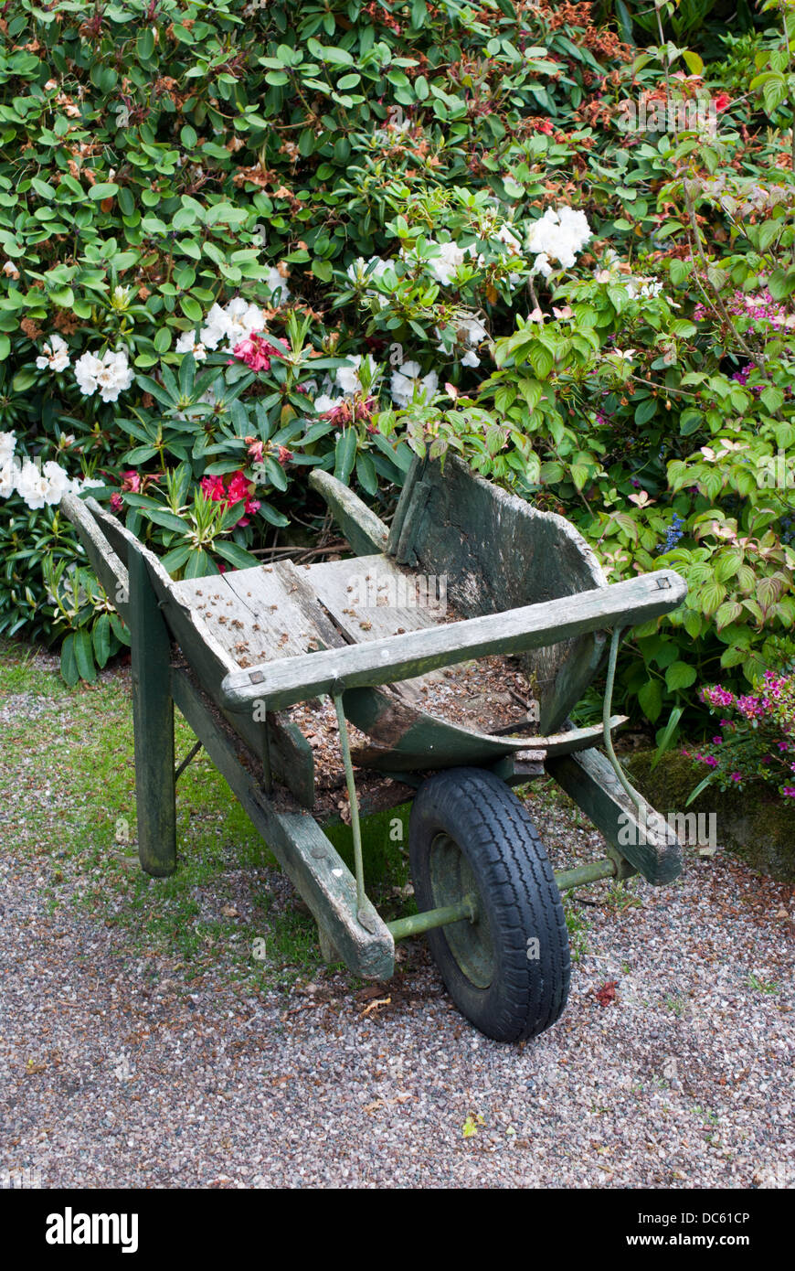 An empty old wooden wheelbarrow Stock Photo