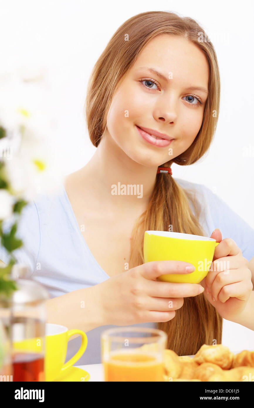 Beautiful young woman drinking tea Stock Photo Alamy