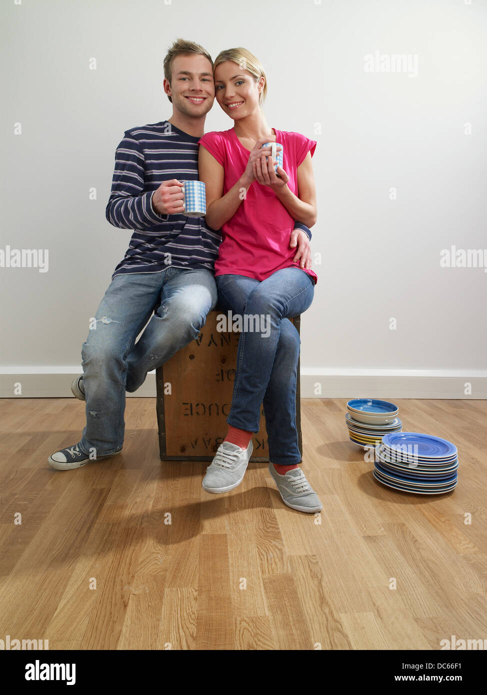 A couple taking a break in their new home Stock Photo