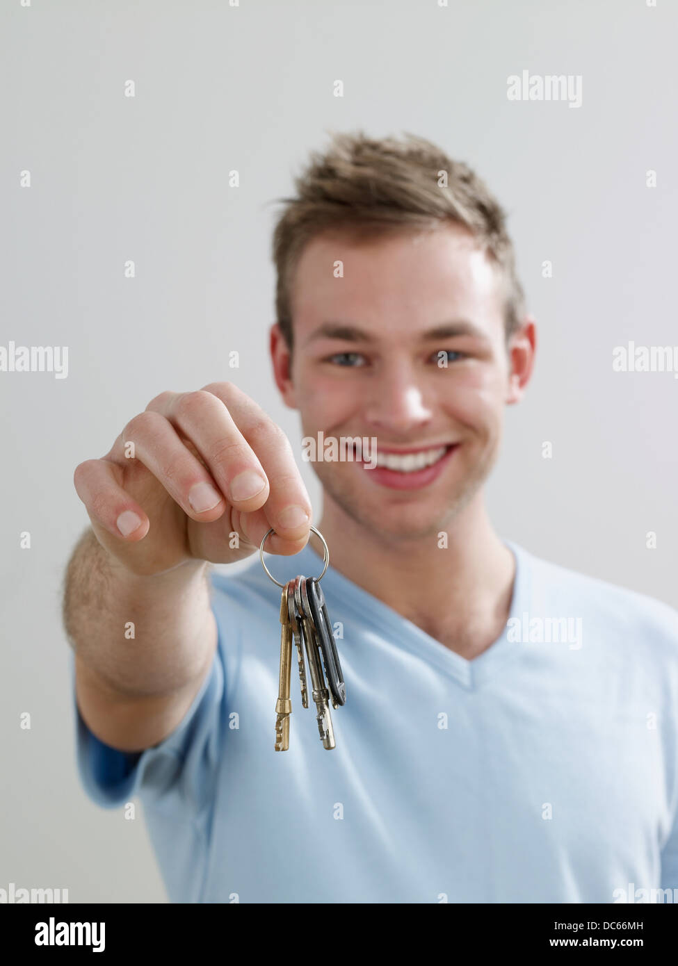man holding house keys Stock Photo