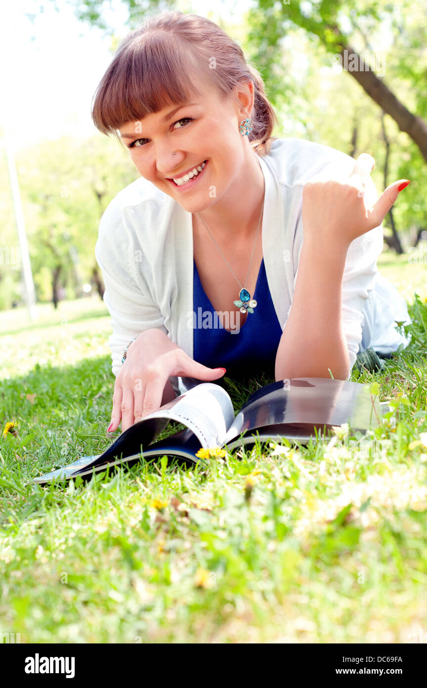 portrait of a beautiful woman in summer park Stock Photo - Alamy