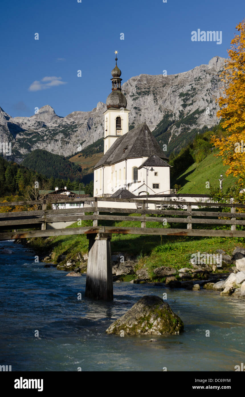 Church with mountains of the Reiteralpe in Ramsau in vertical format Stock Photo