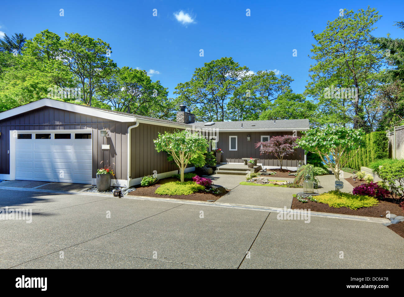 Beautiful home with garage, lake view and large front yard. Stock Photo