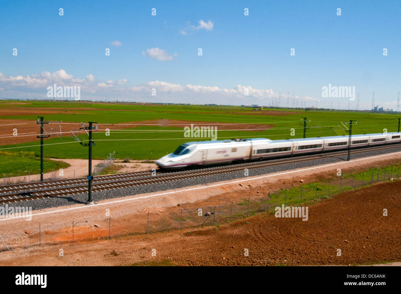 Madrid-Valencia high-speed train traveling along the country. Ocaña, Toledo province, Castilla La Mancha, Spain. Stock Photo