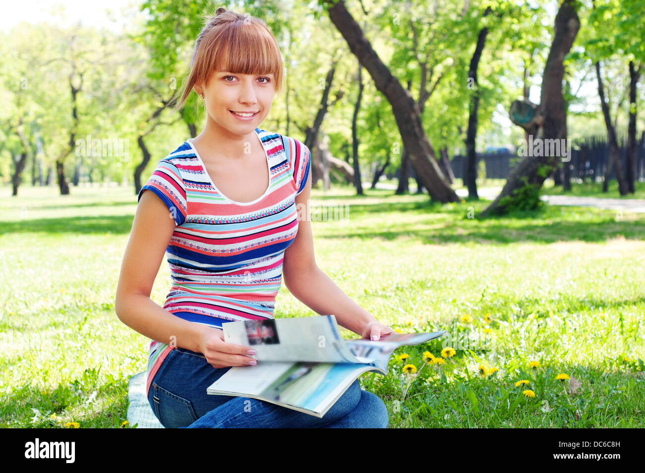 portrait of a beautiful woman in summer park Stock Photo - Alamy