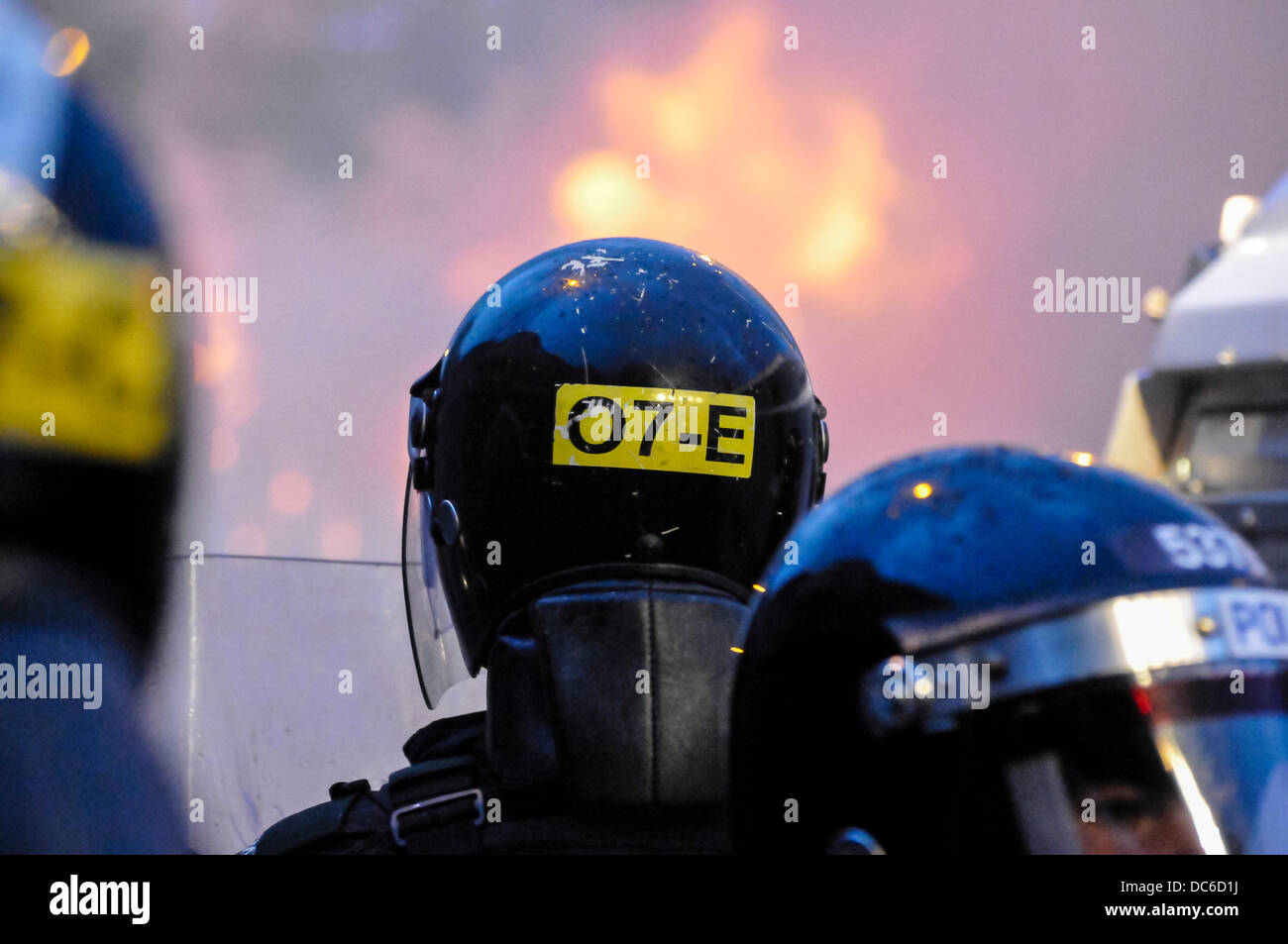 Belfast, Northern Ireland. 9th August 2013 - PSNI officers look on after a crowd of protesting loyalists start a riot against the police and set a van on fire in Belfast Credit:  Stephen Barnes/Alamy Live News Stock Photo