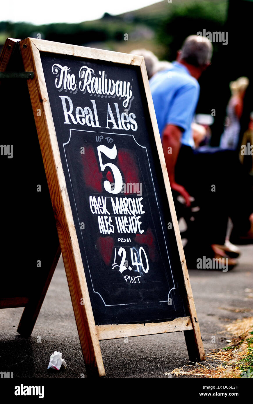 A sign offerign alcohol for sale at a Yorkshire fayre Stock Photo