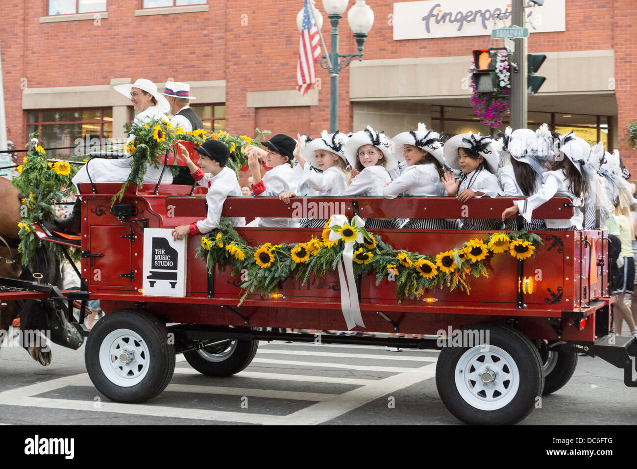 August 2, 2013, Saratoga Springs, NY.  Participants parade down Broadway in the annual 'Floral Fete Promenade.' Stock Photo