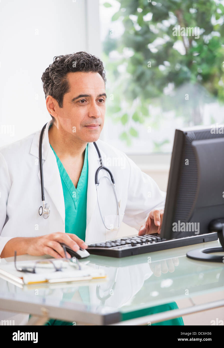 Portrait of doctor working in office Stock Photo Alamy