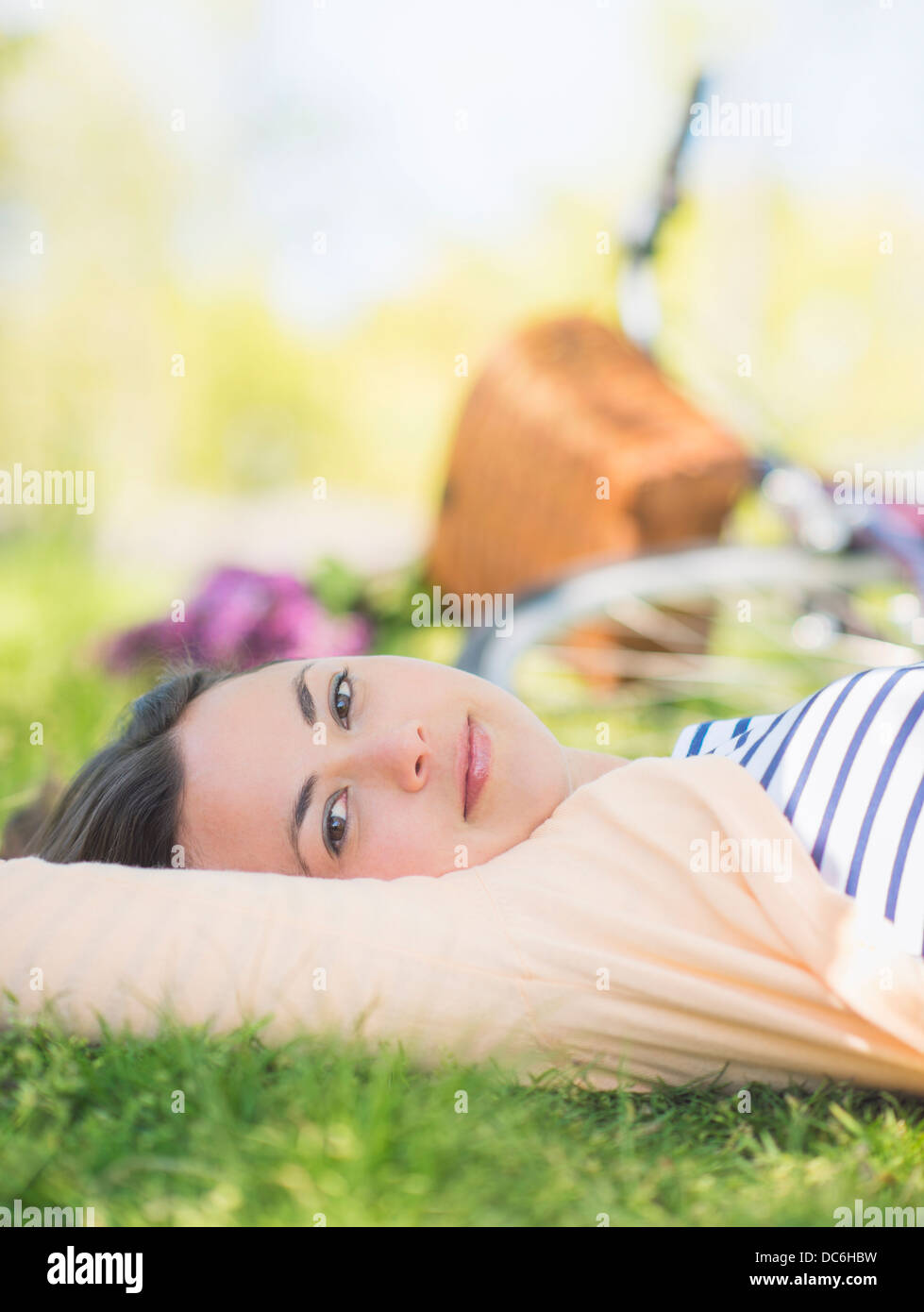 USA, New York State, New York City, Central Park, Portrait of mid adult woman relaxing in park Stock Photo