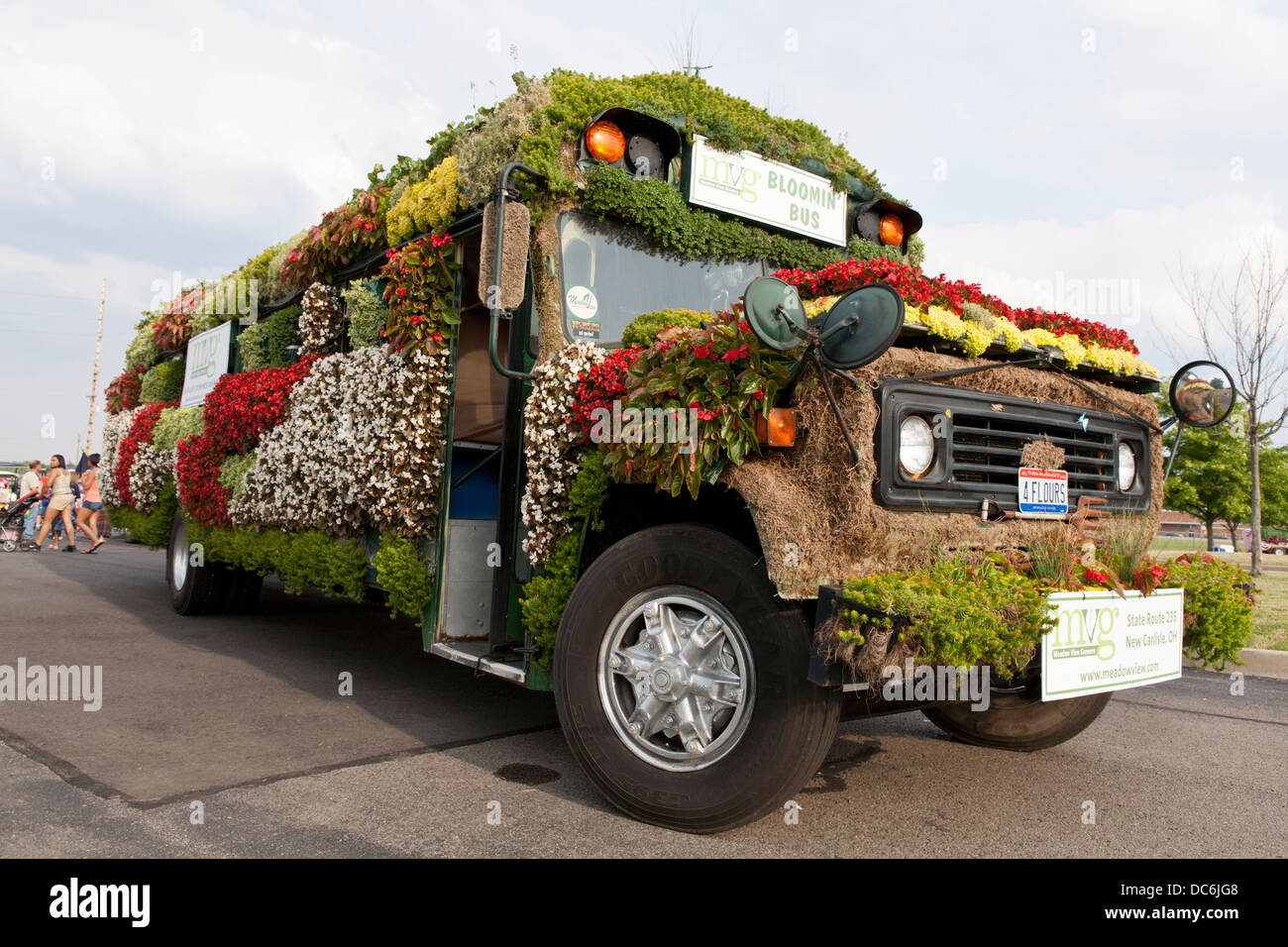 Schoolbus decorated with live flowers. Stock Photo