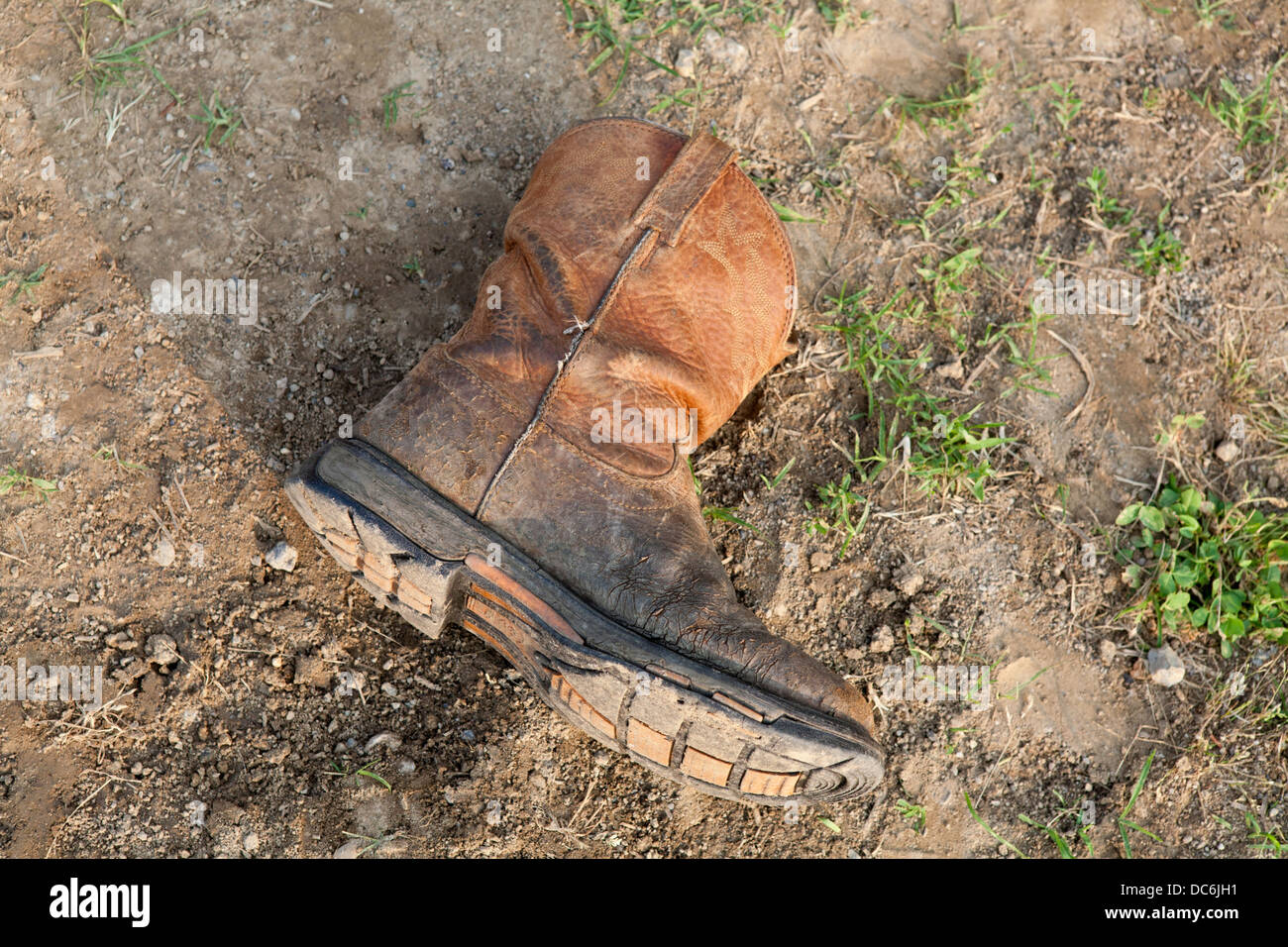 Cowboy boot on the ground Stock Photo - Alamy