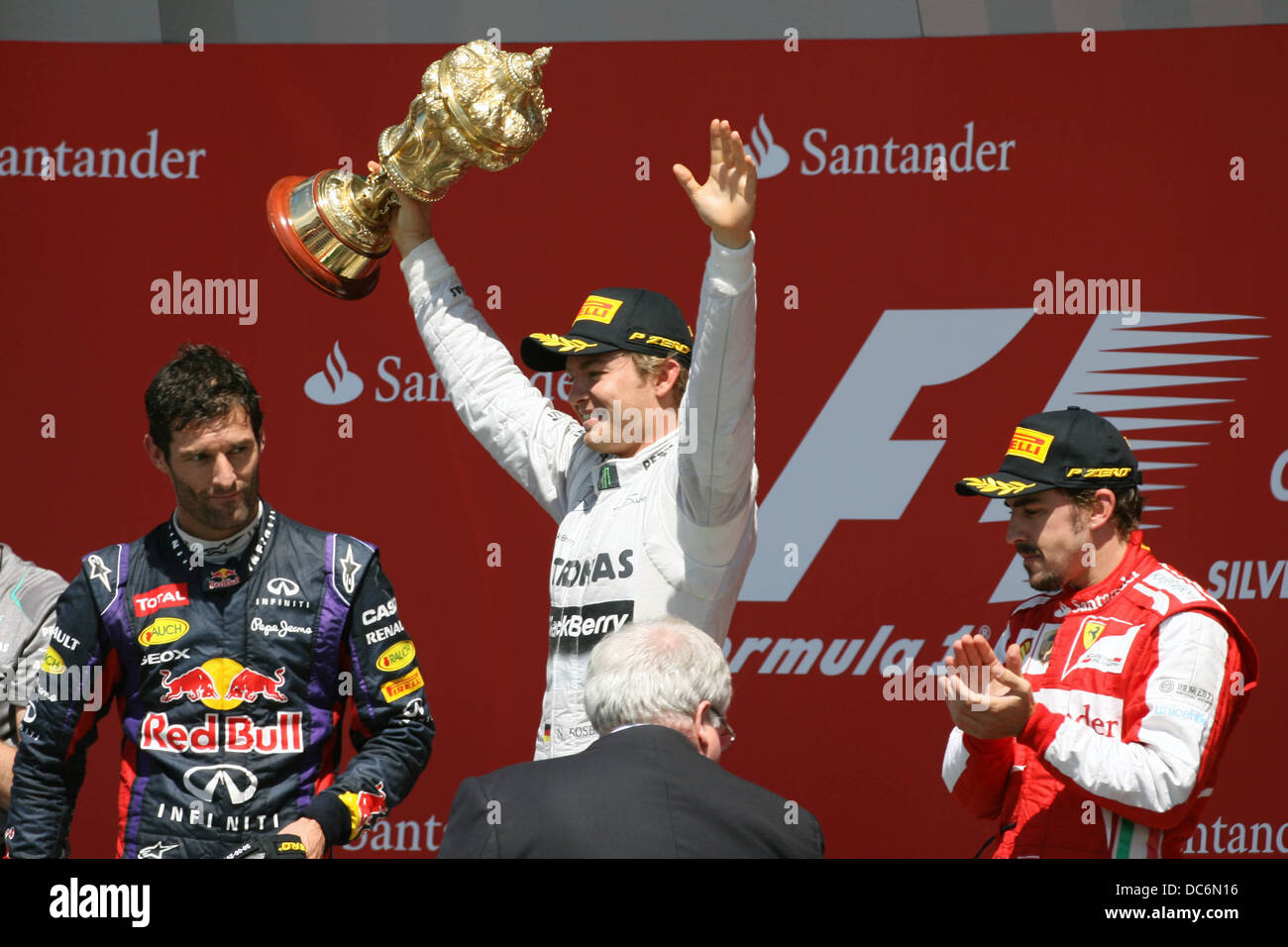 Nico Rosberg celebrates winning on the podium at the 2013 F1 British Grand Prix, Silverstone. Stock Photo