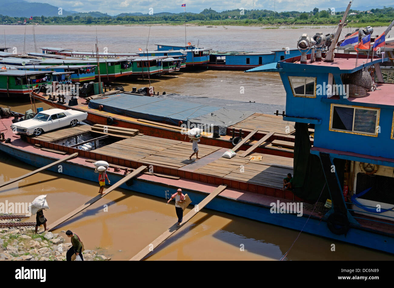 Chinese boats loading  freight at Chiang Saen,Thailand Stock Photo