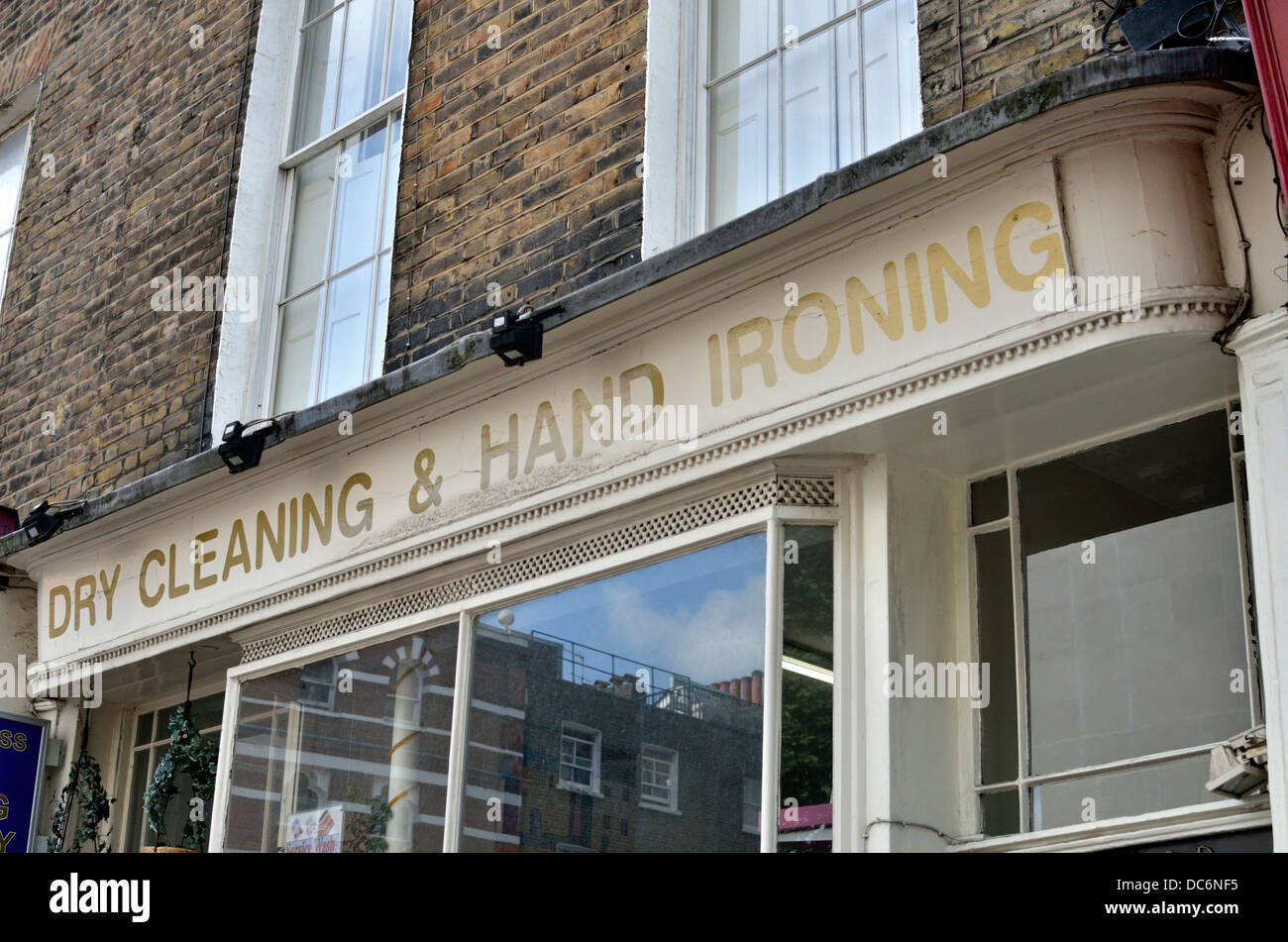 Dry cleaning and hand ironing shop, London, UK Stock Photo