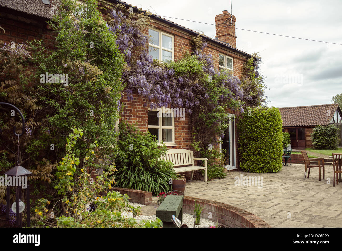 English Red Brick Traditional House And Patio Stock Photo
