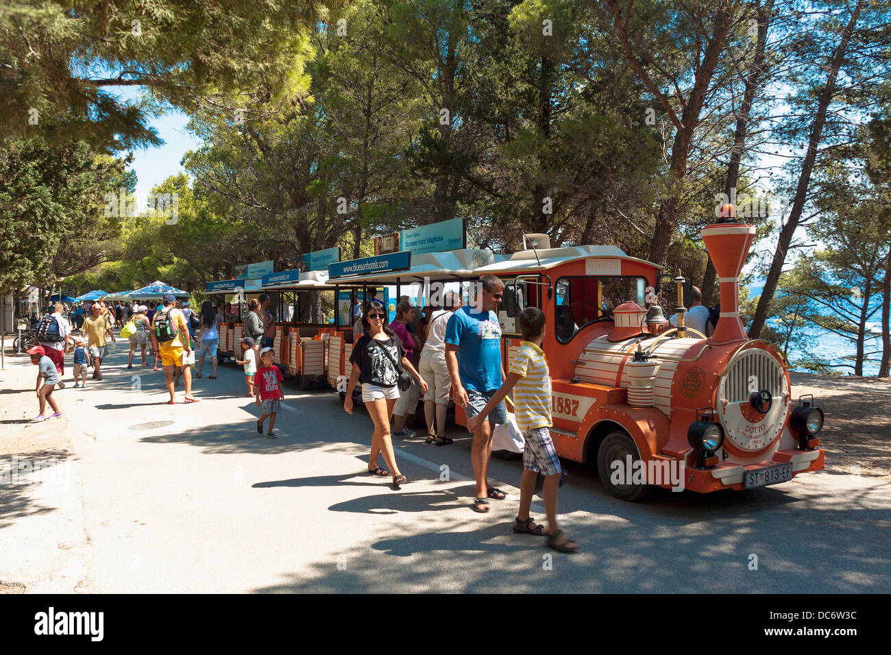 Tourist toy train carrying people to Zlatni Rat beach in Bol on Brač  island, Croatia Stock Photo - Alamy