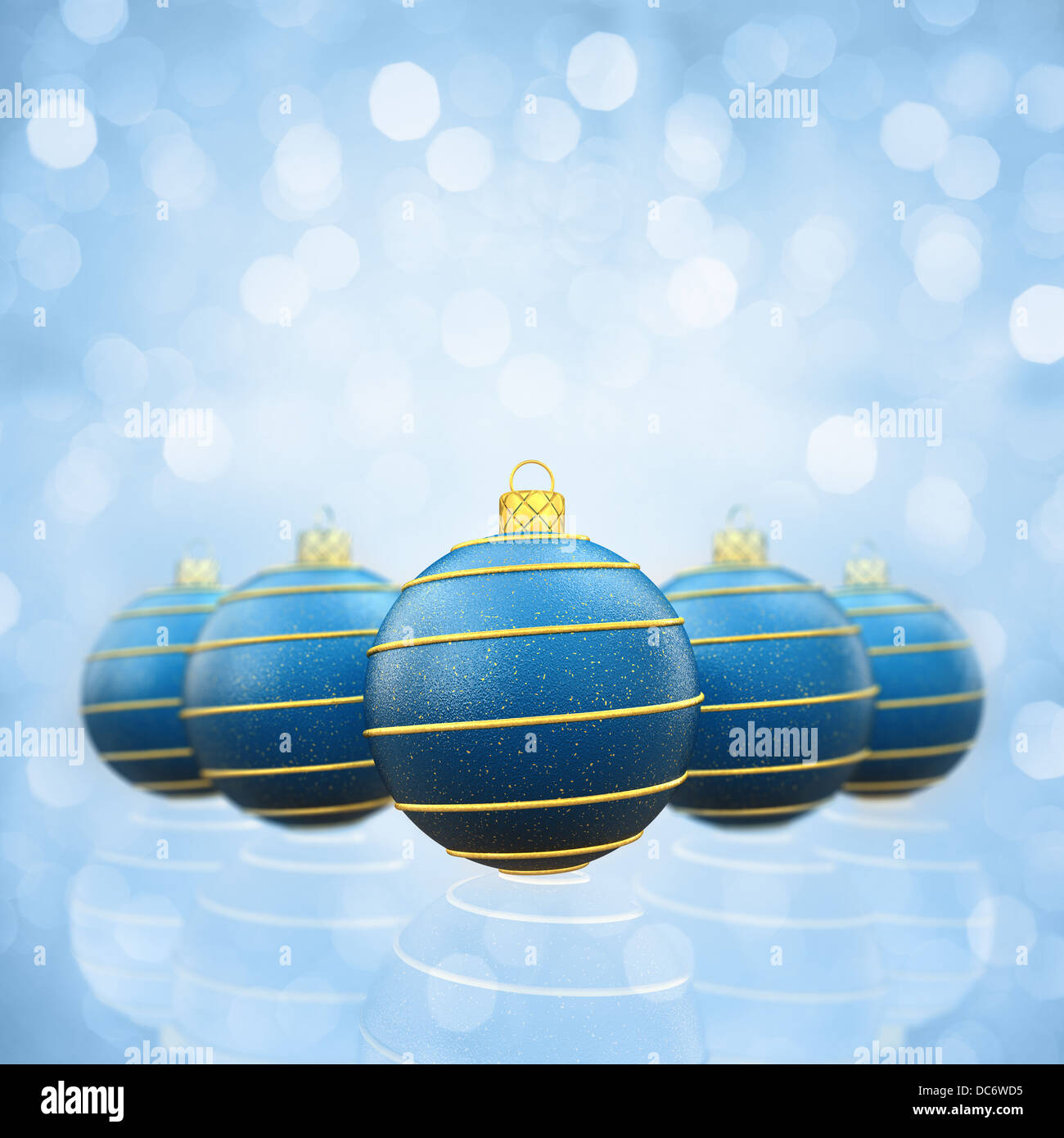 Blue and gold christmas baubles on glittery background Stock Photo - Alamy