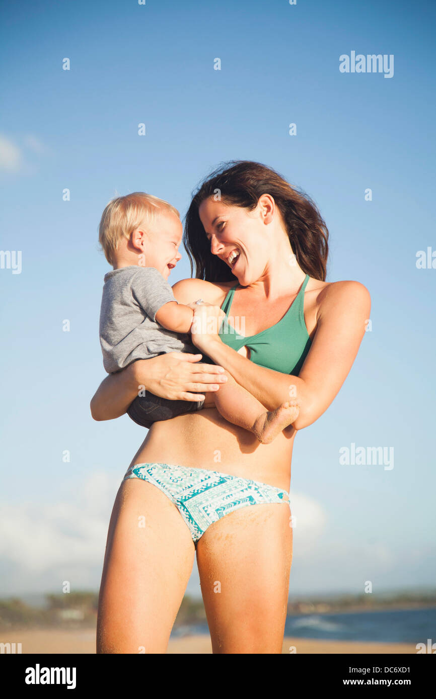 USA, Hawaii, Kauai, Mother with baby boy (6-11) in arms Stock Photo