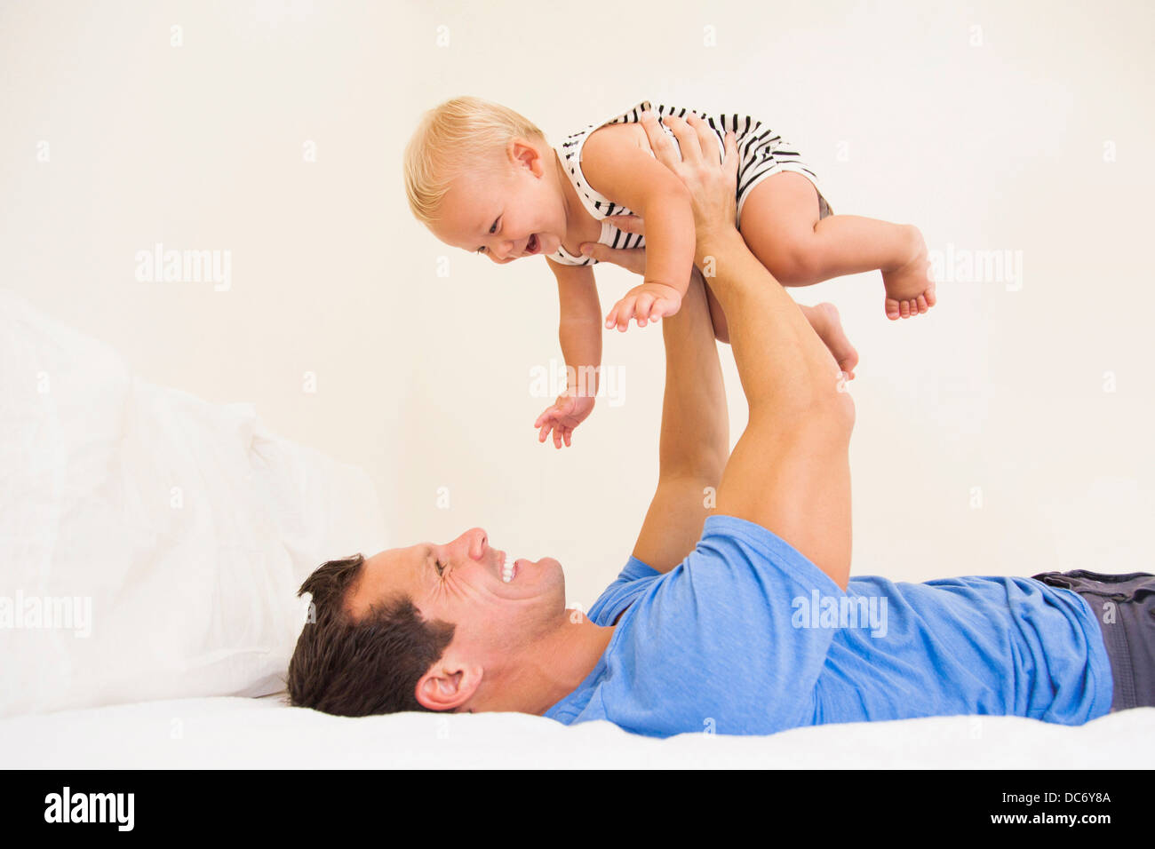 Man playing with baby boy (6-11 months) Stock Photo