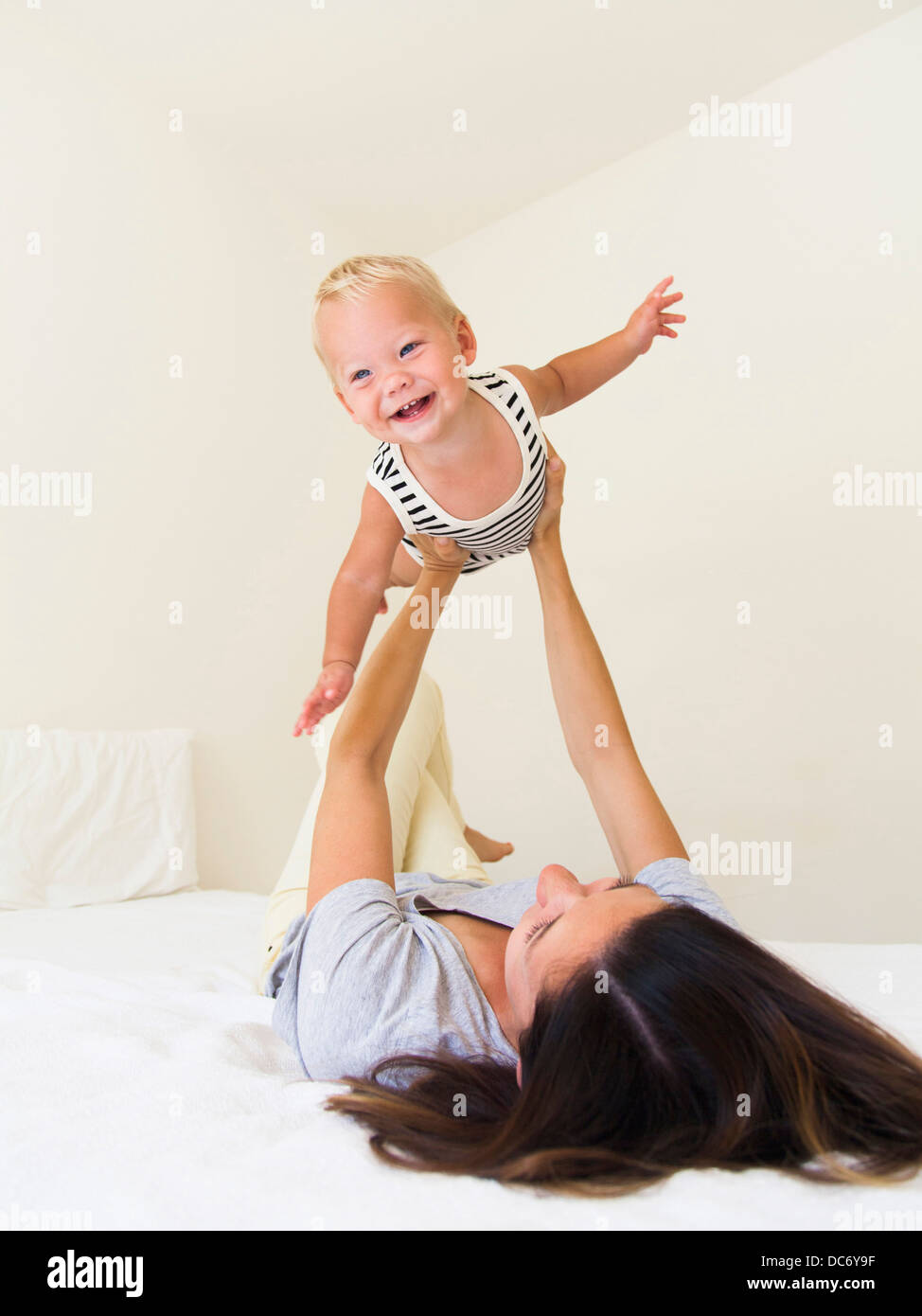 Mother playing with baby boy (6-11 months) Stock Photo
