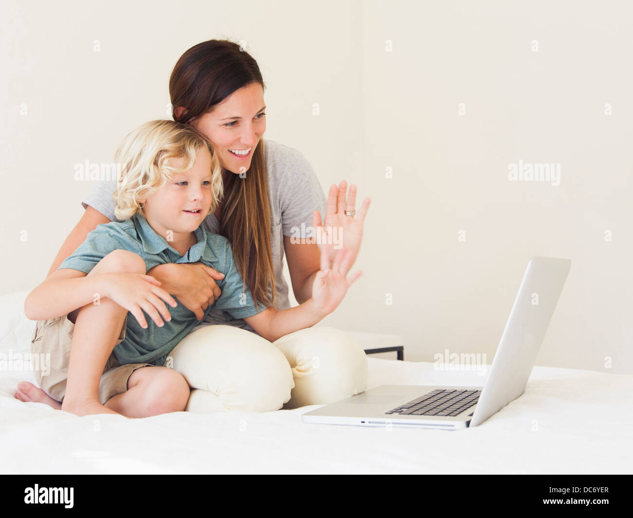 Mother with son (6-7) using laptop Stock Photo