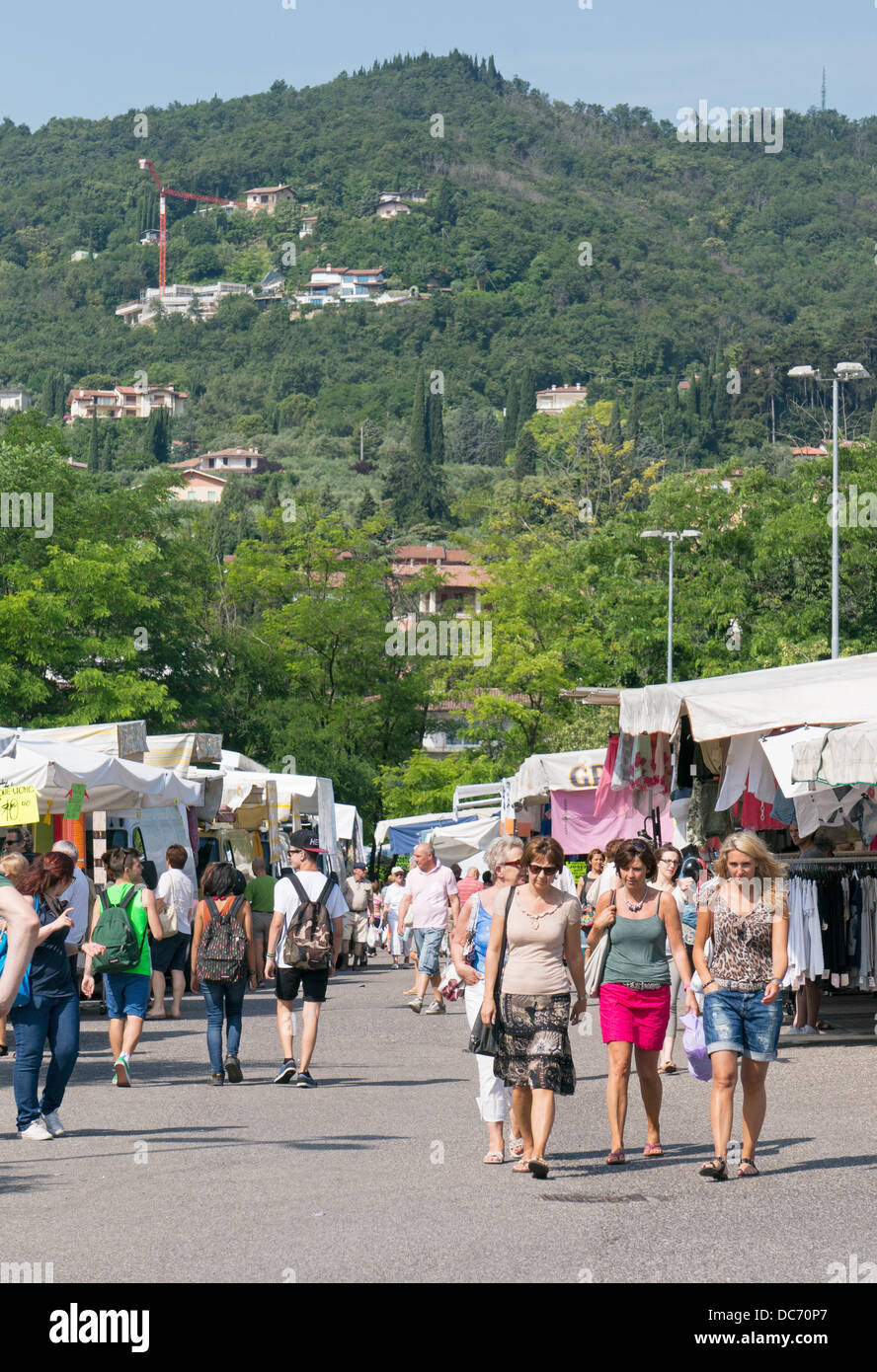Women walking through the open air market at Salo, Italy, Europe Stock Photo