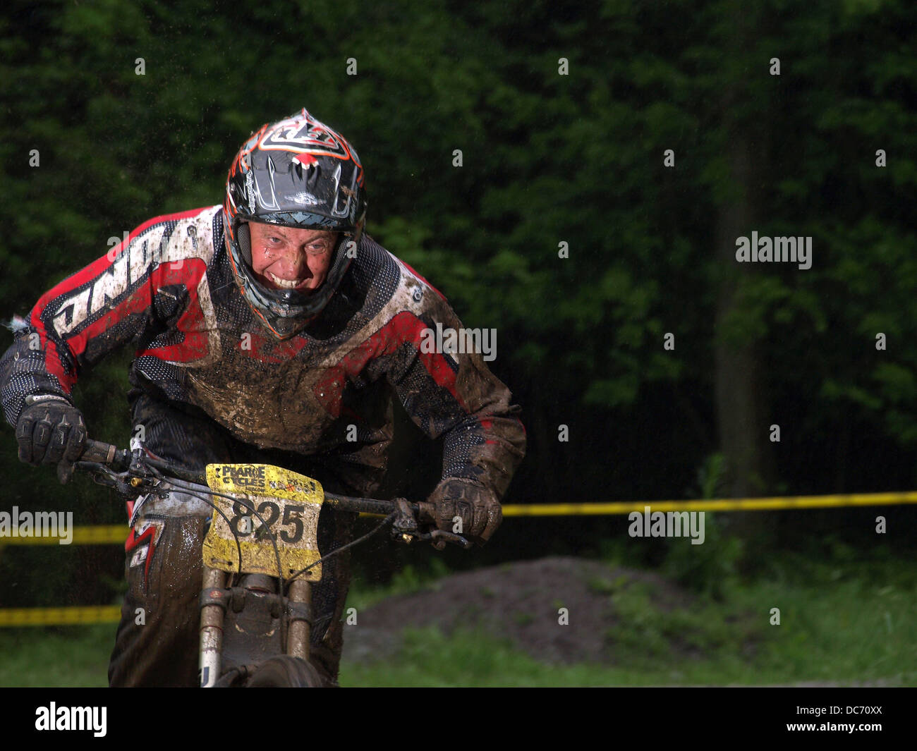 Muddy mountain biker Stock Photo Alamy