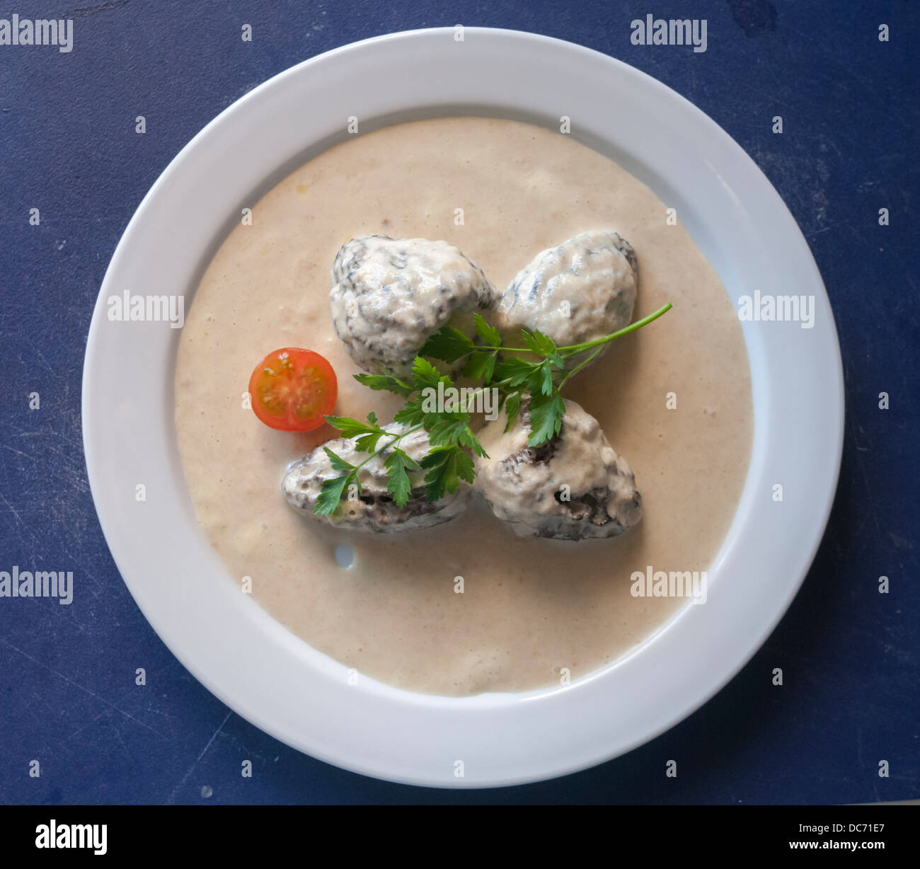 Morel with sauce Stock Photo Alamy