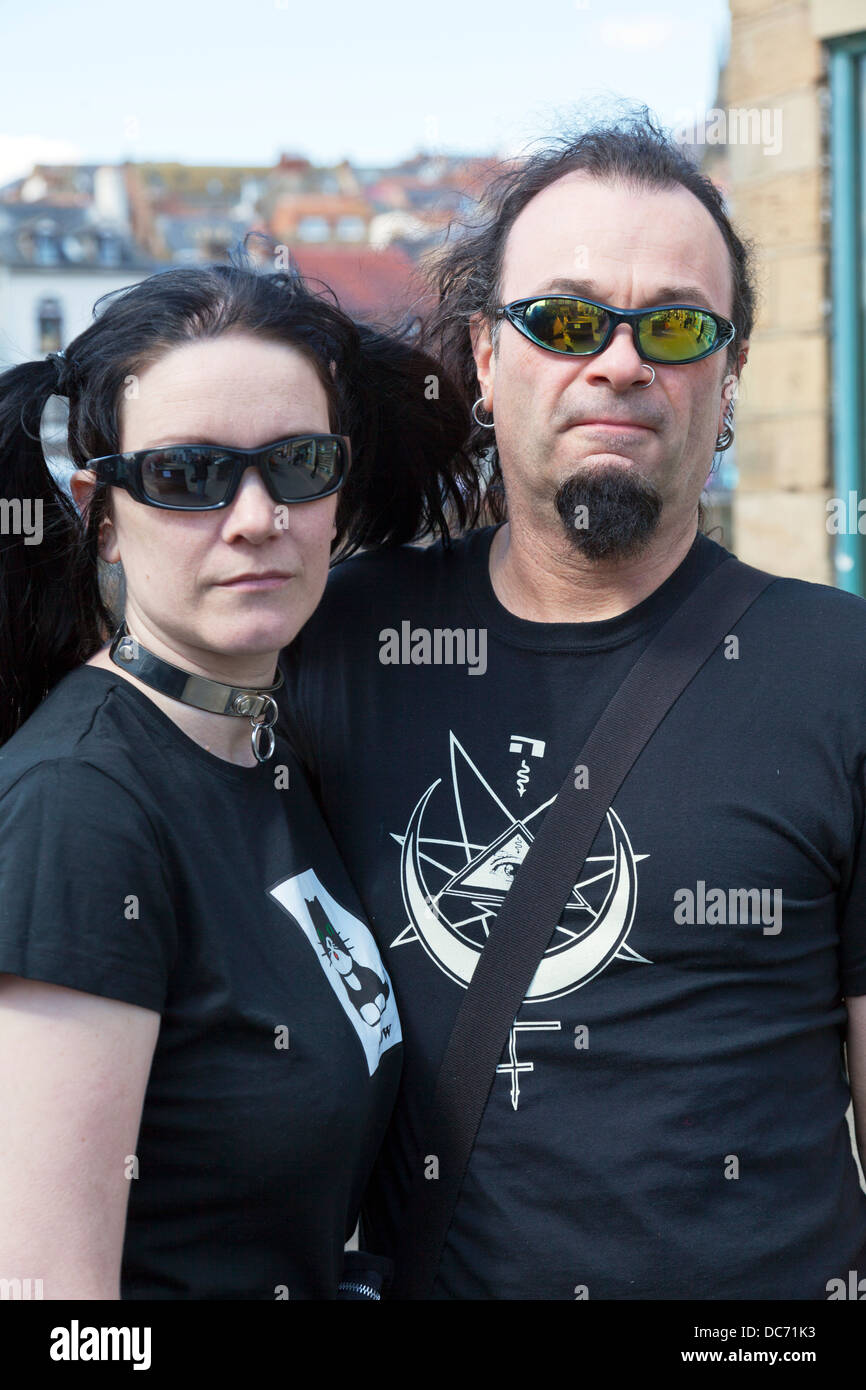 Two goths emo heavey metal fans couple wearing black sunglasses rockers goth gothic Stock Photo