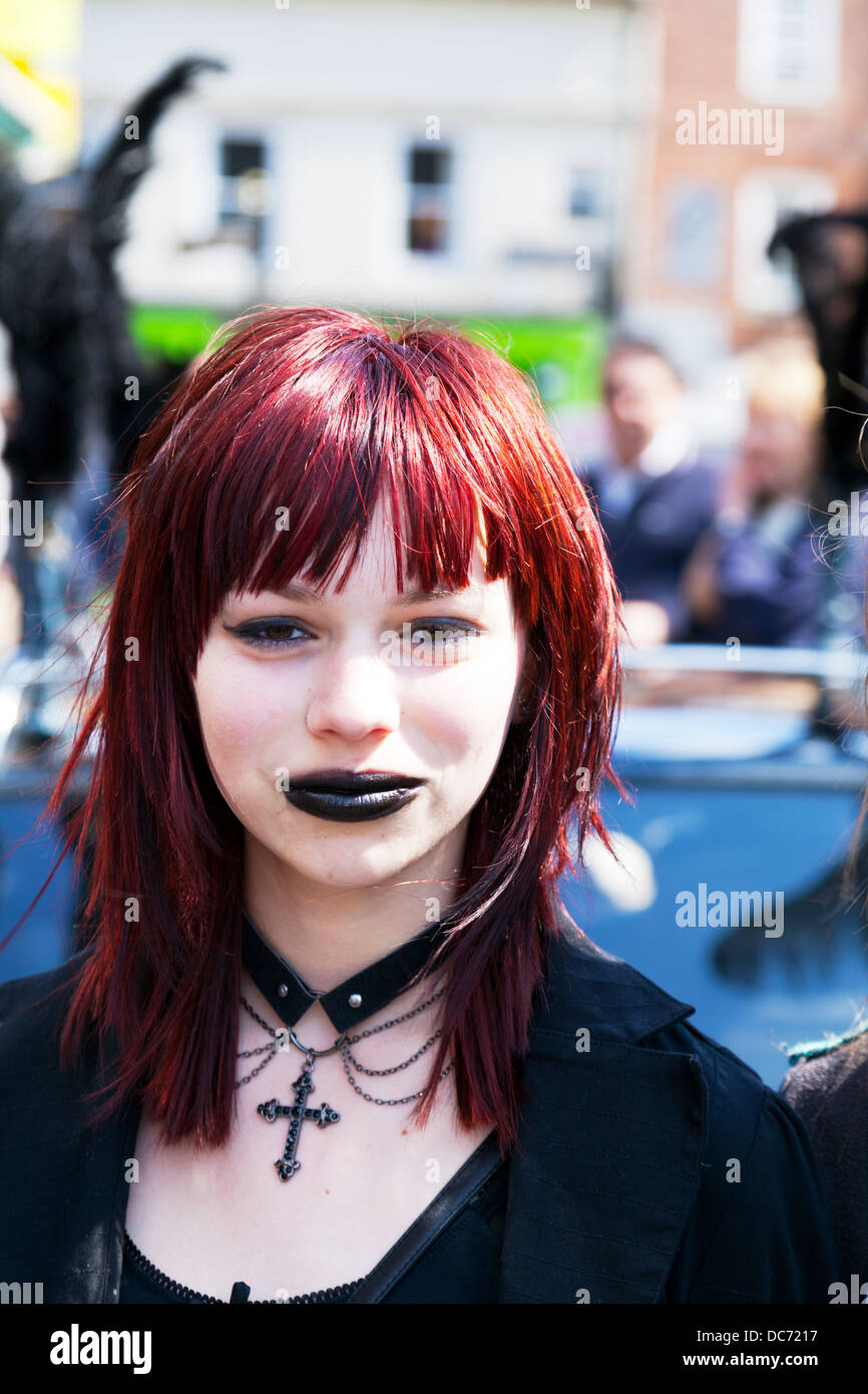 Teen heavy metal fan with ginger hair posing emo goth gothic black lipstick cross necklace pretty Stock Photo