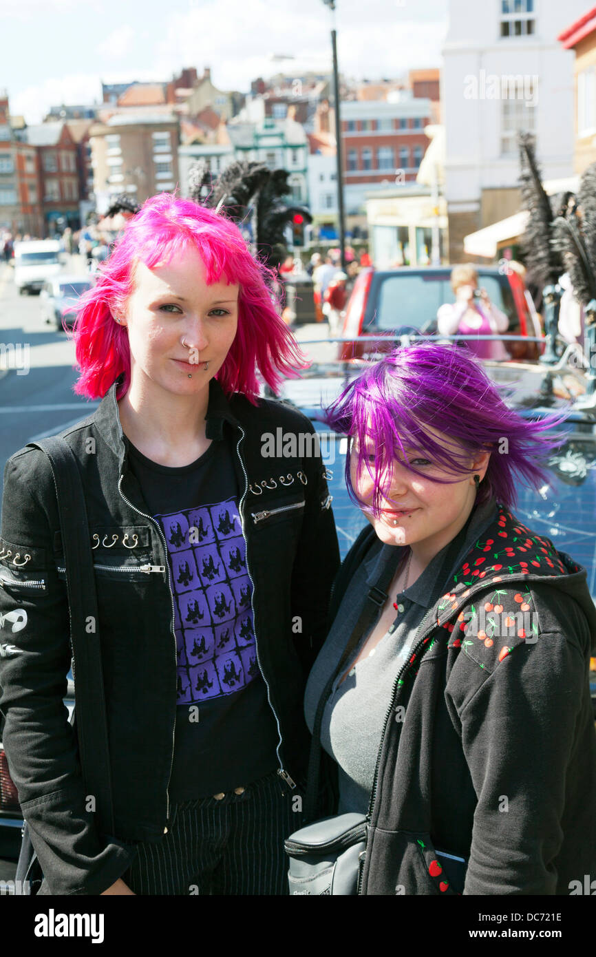 Teen heavy metal fans with pink purple hair posing emo goth gothic Stock Photo
