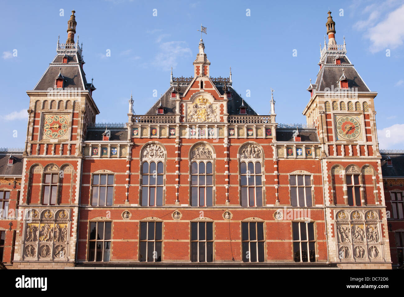 Amsterdam Central Train Station facade in Holland, Netherlands, 19th century Neo-Renaissance and Neo-Gothic style. Stock Photo