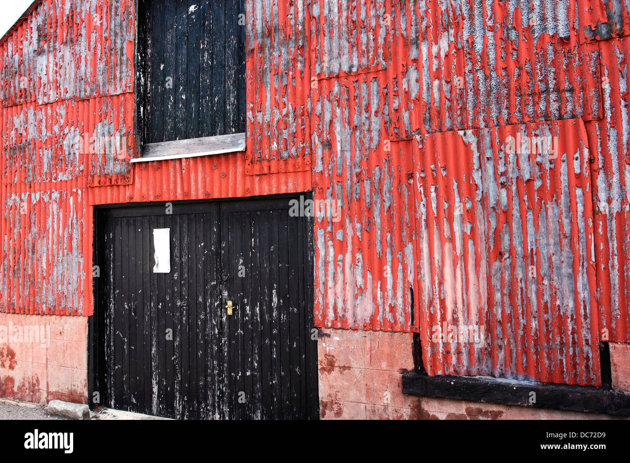 A Dilapidated Corrugated Iron Storage Shed With Red Ling