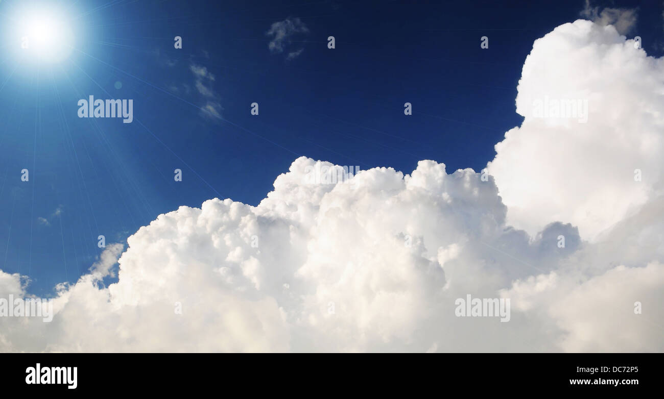 Cloudy stormy sky with sun rays Stock Photo