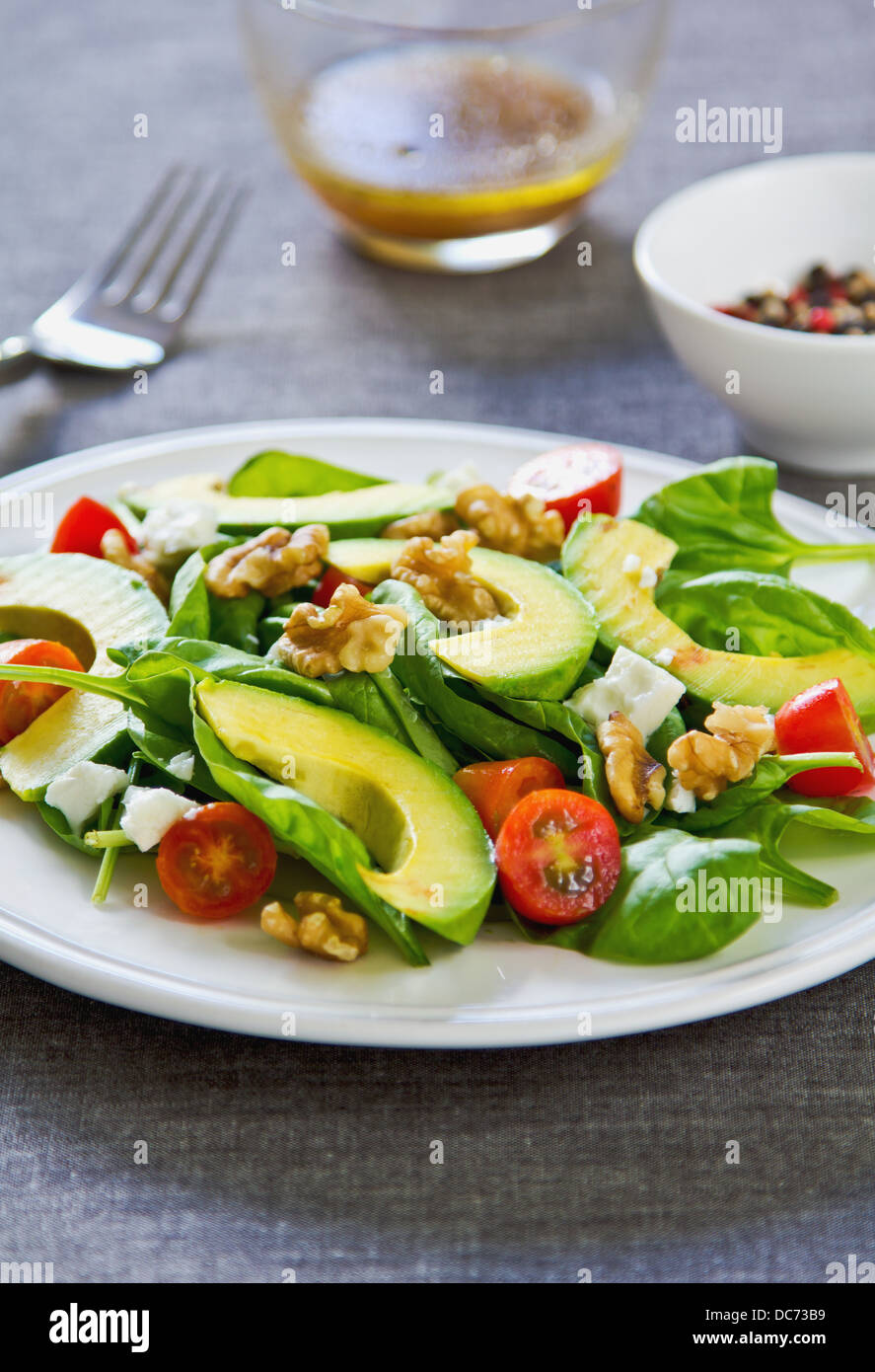 Avocado with Spinach, Feta and Walnut salad Stock Photo Alamy