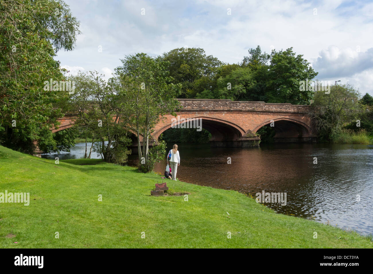 Woman and children by the bridge over the river Teith at Callander Perthshire Scotland Stock Photo