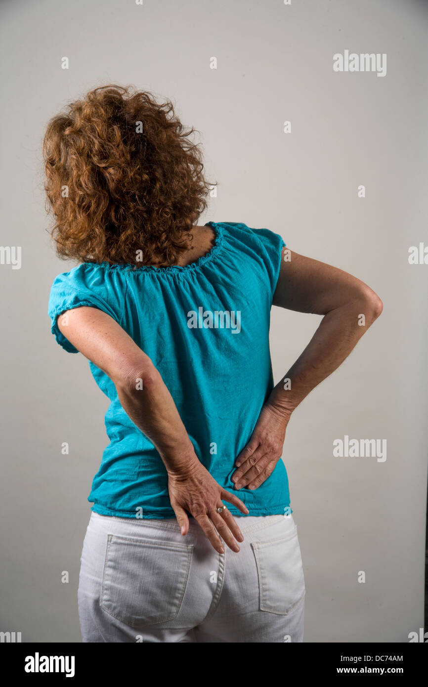 Lower back pain woman old hi-res stock photography and images